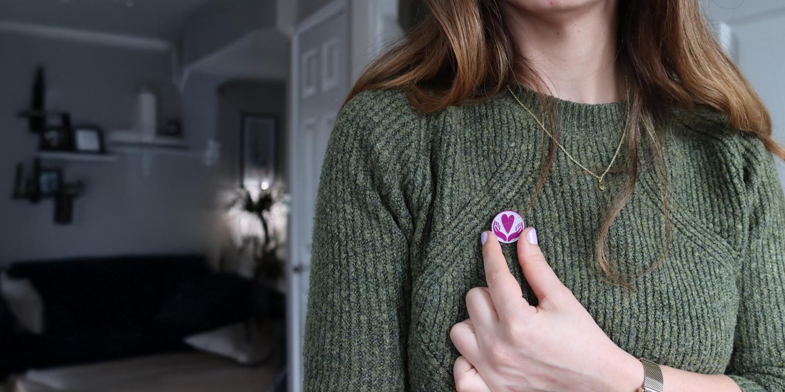 Pin Badge on Green Jumper