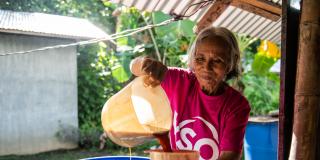 Volunteer Jovencia prepares Biogrow Seaweeds Fertilizer