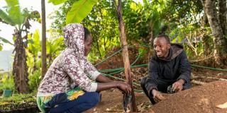 Youth planting seeds