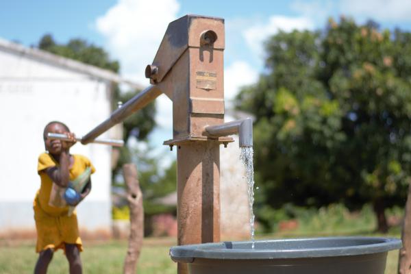 Child with water pump