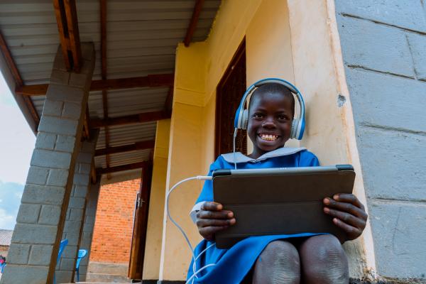 Smiling child with tablet
