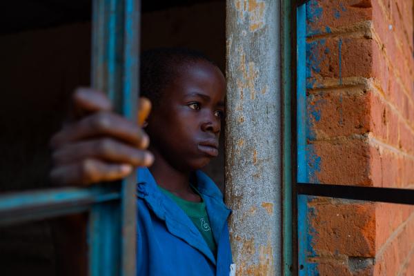 Student Lonjezo stood in an empty classroom in his school. There are not enough teachers in his school, so some classes remain empty.