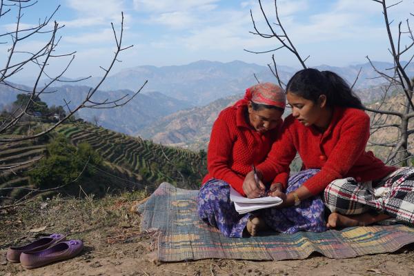 Girl teaches mother to write