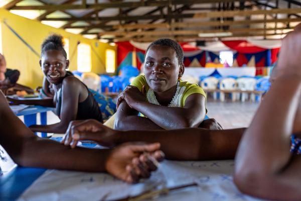 Girls in a classroom smiling