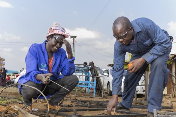Man and woman welding