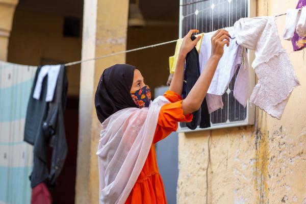 Girl hanging washing