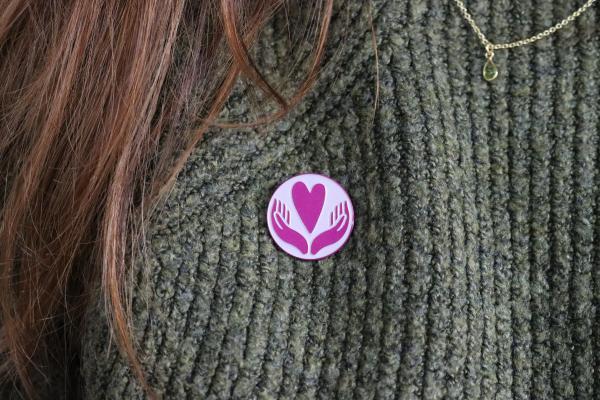 Pin Badge on Green Jumper