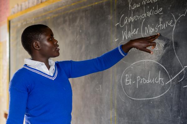 Emily stands at the front of her class