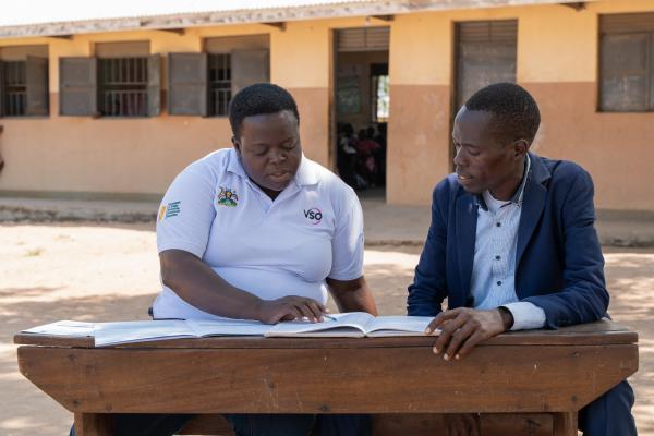 Semmy works with teacher Samuel 