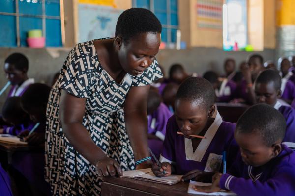 Teacher Barbra helps Nakiru in class